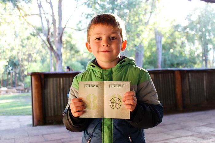 boy holding nature passport