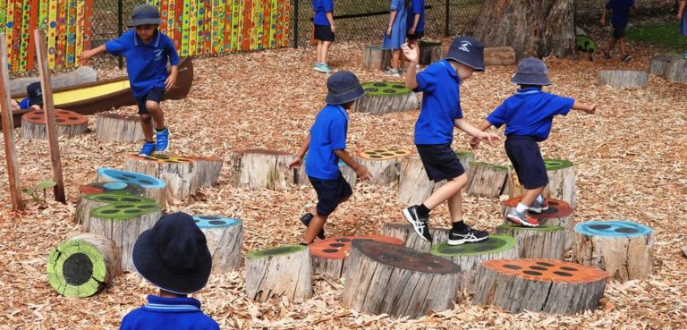 Children playing in Woodbridge school play space