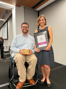 Senator for WA Jordon Steele-John holds Nature Play WA's award and Dr Kelsie Prabawa-Sear holds the framed certificate award for Not-For-Profit/Community Organisation App of the Year 2023.