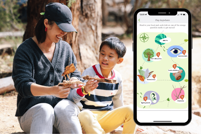 A photo of an adult and child sitting in nature, holding some bark. A phone screen featuring a screen from the Play Anywhere trail with different activities is also displayed.