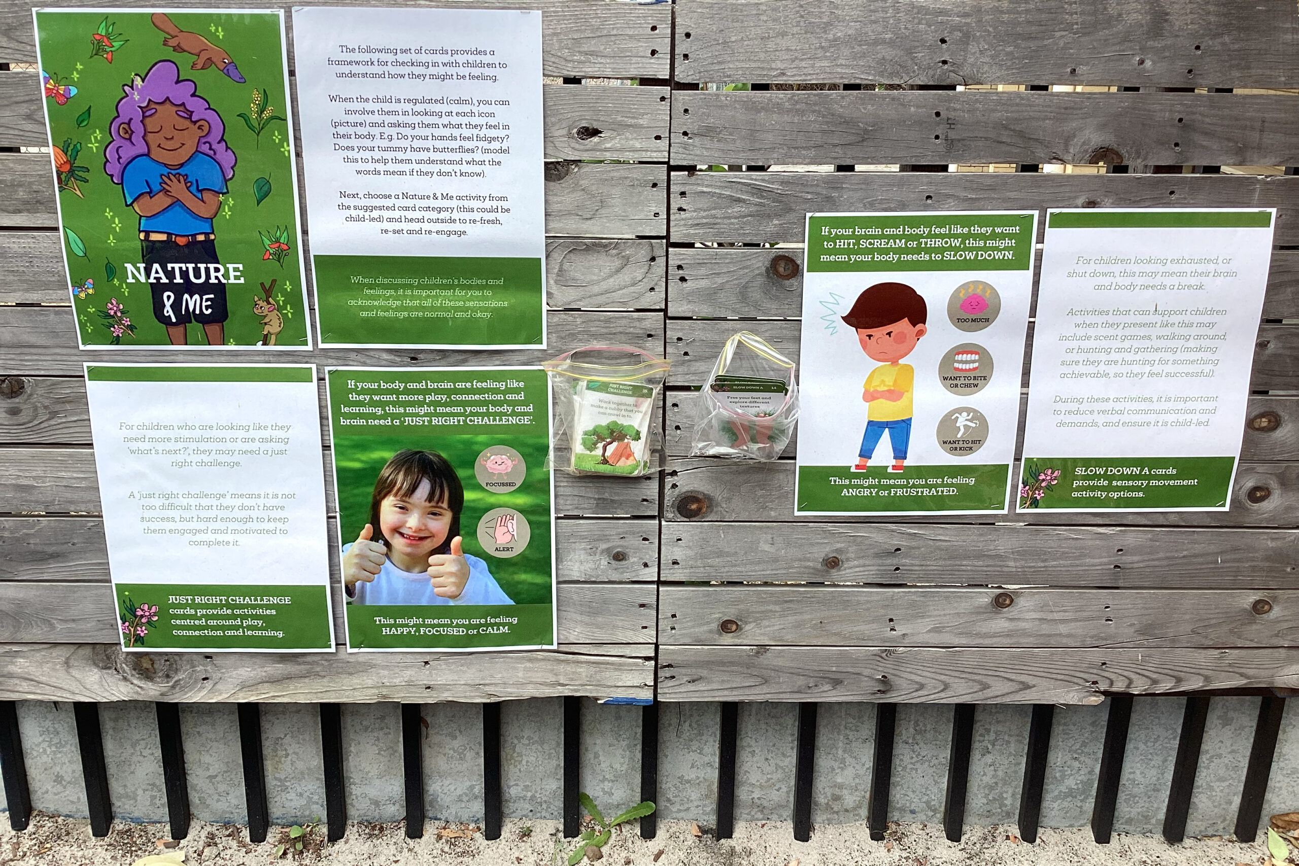 Nature and Me posters displayed on fence