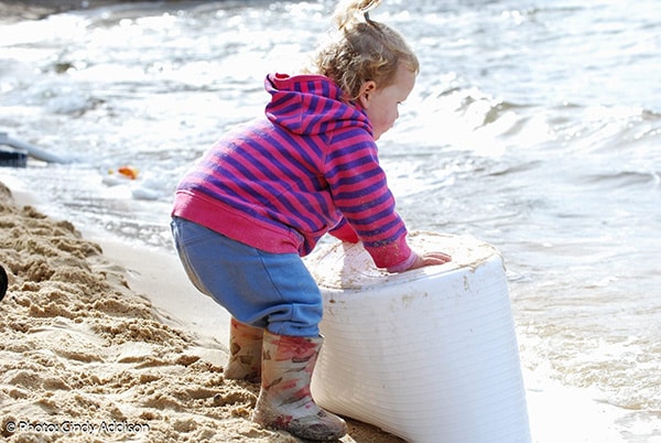 Baby playing in nature at the beach