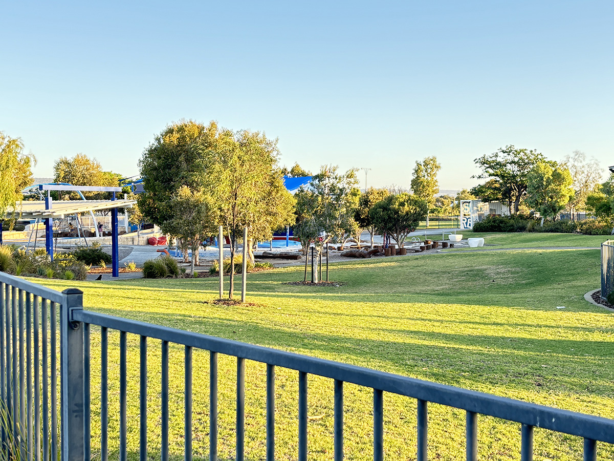 Shipwreck Park fenced playground grassy slope
