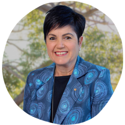 A photo of Rishelle Hume smiling at the camera.